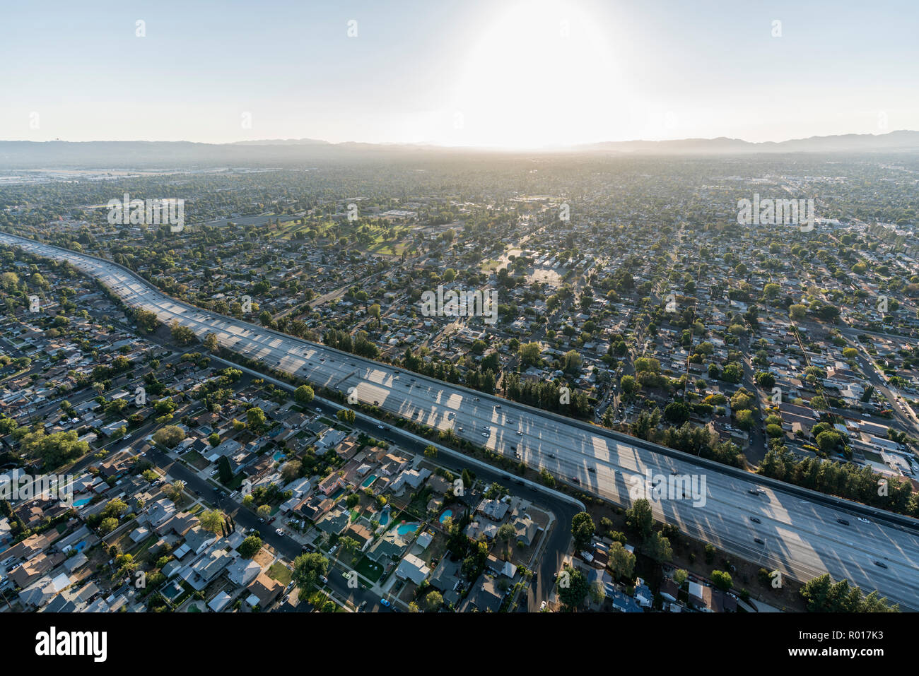 Sunset aerial view of Route 405 freeway crossing the San Fernando Valley in Los Angeles, California. Stock Photo
