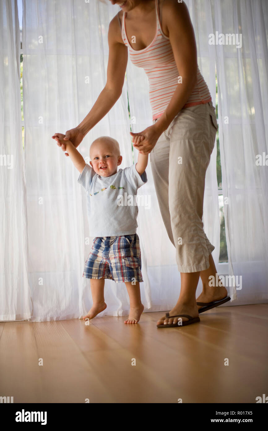 how to help baby take first steps