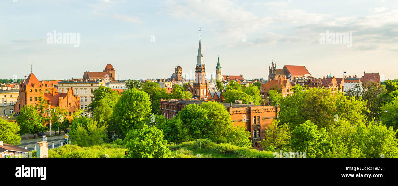 Rare seen Toruń old town panorama seen from north in golden hour light. Stock Photo