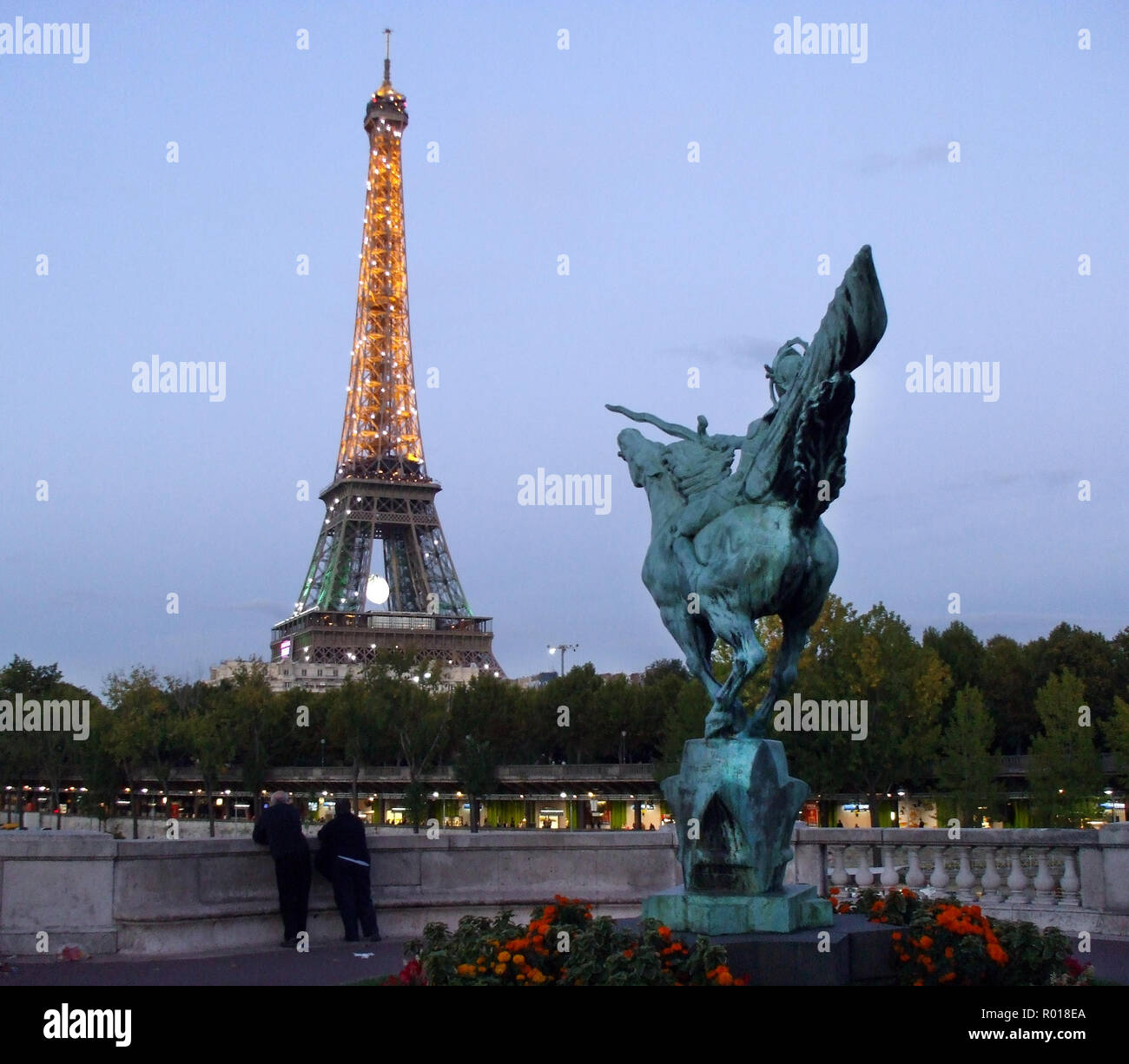 The Eiffel tower, lit up as dusk falls, as seen from a viewpoint in the  Trocadero Gardens which sit opposite the tower in Paris, France Stock Photo  - Alamy
