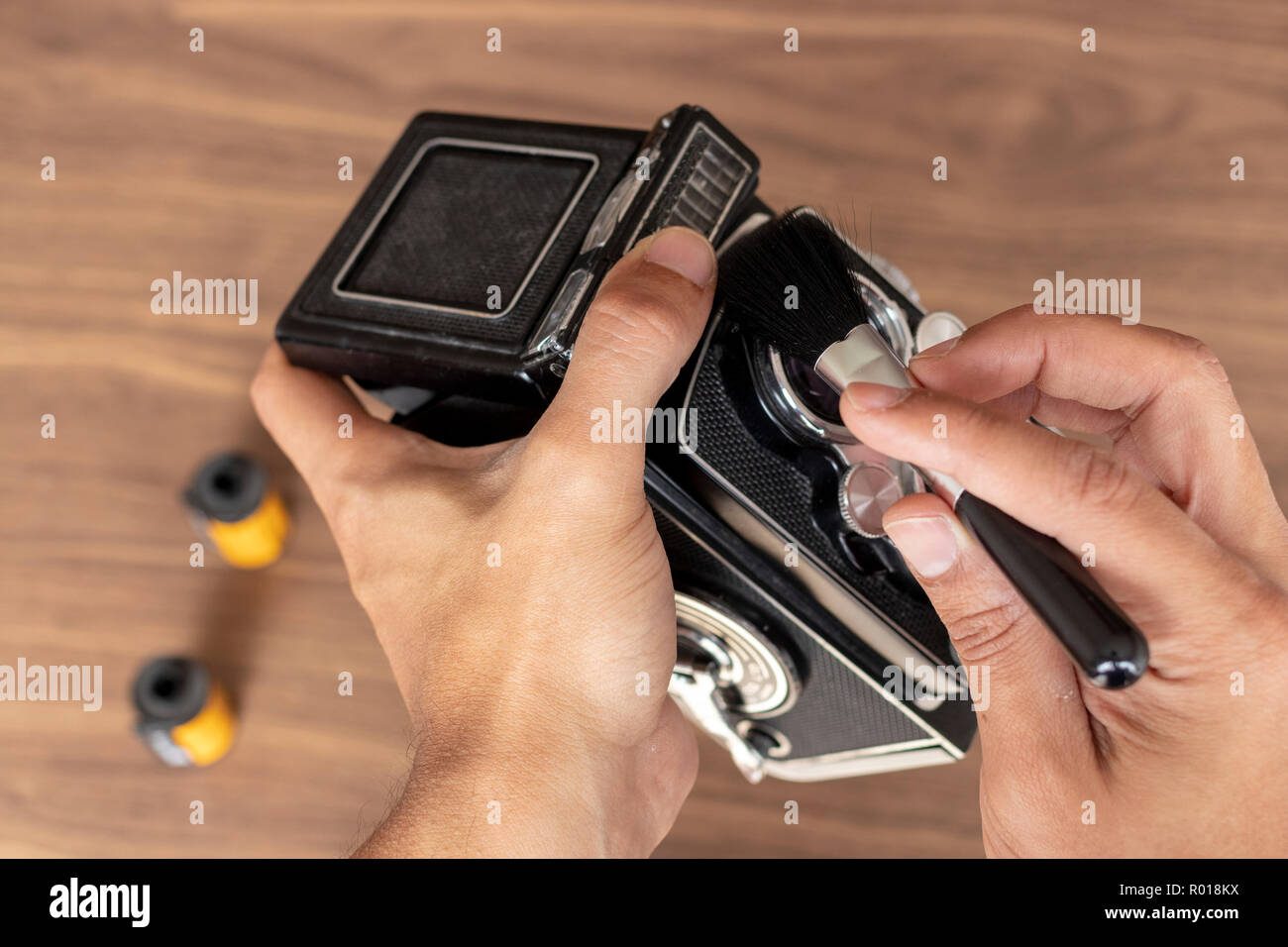 Performing cleaning of vintage photo camera Stock Photo Alamy