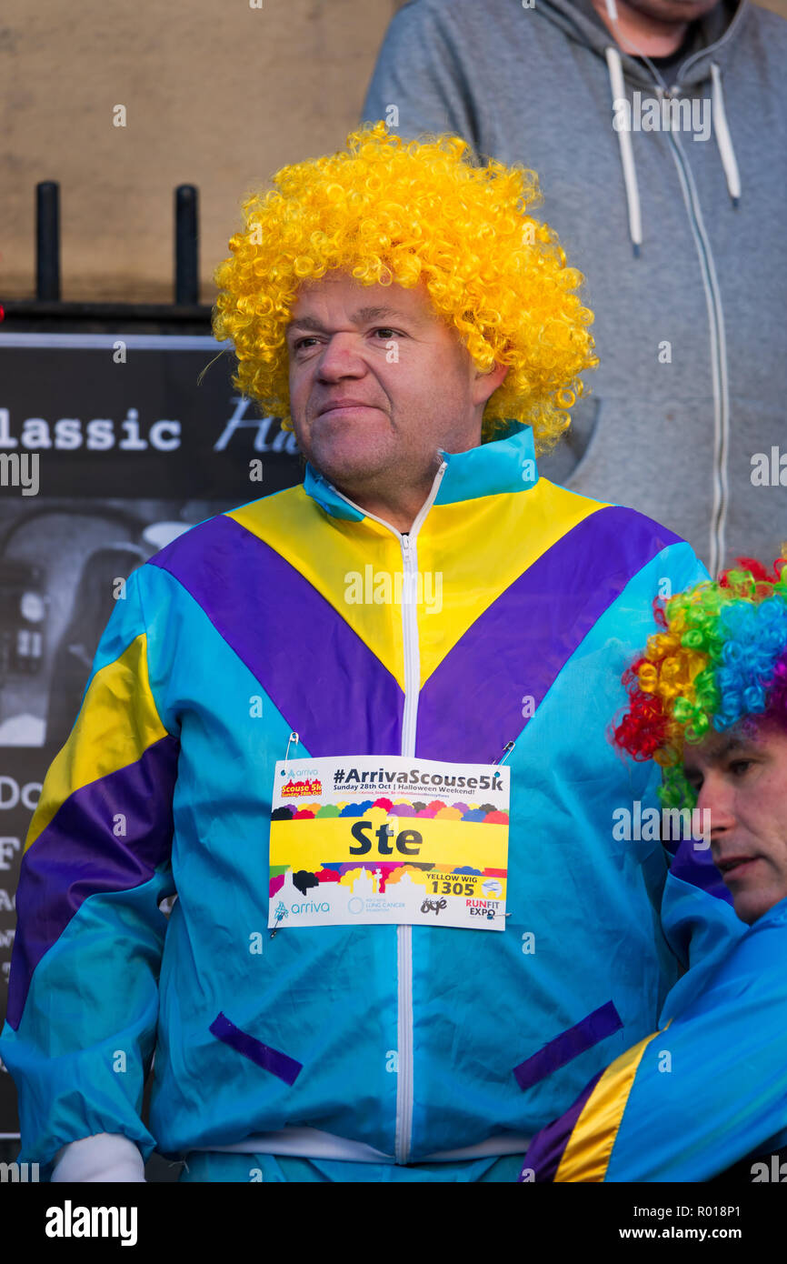 Stereotypical scouser in a curly yellow wig ready to take part in the Scouse 5k fun run 2018 Stock Photo