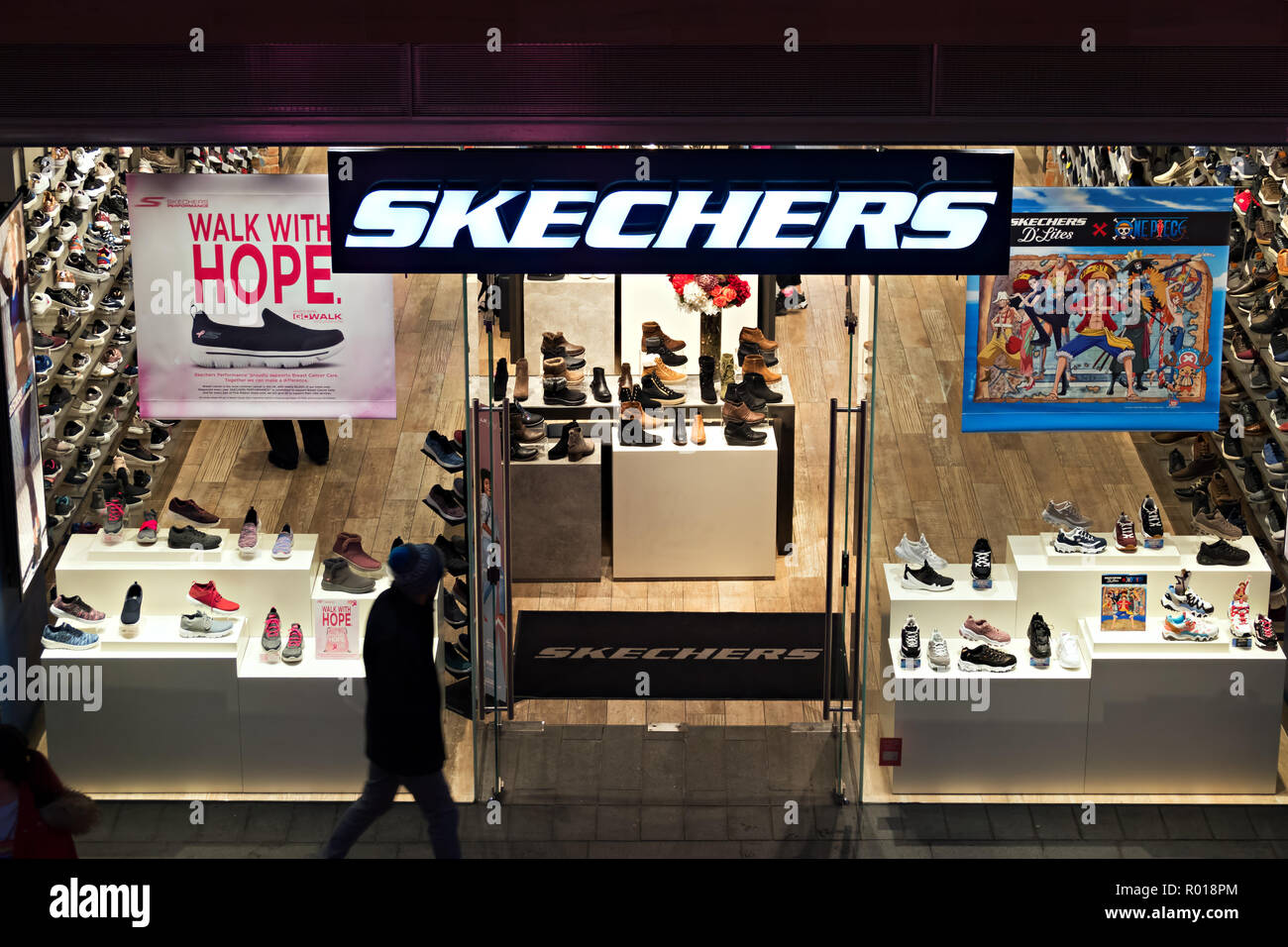 People past a Skechers shop in the evening time at Liverpool One, Liverpool UK Stock Photo - Alamy