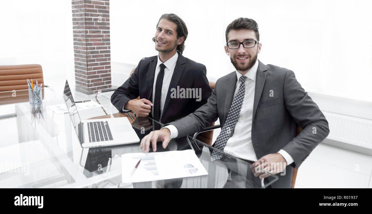Two Business Person Sitting Behind A Desk Stock Photo 223763883