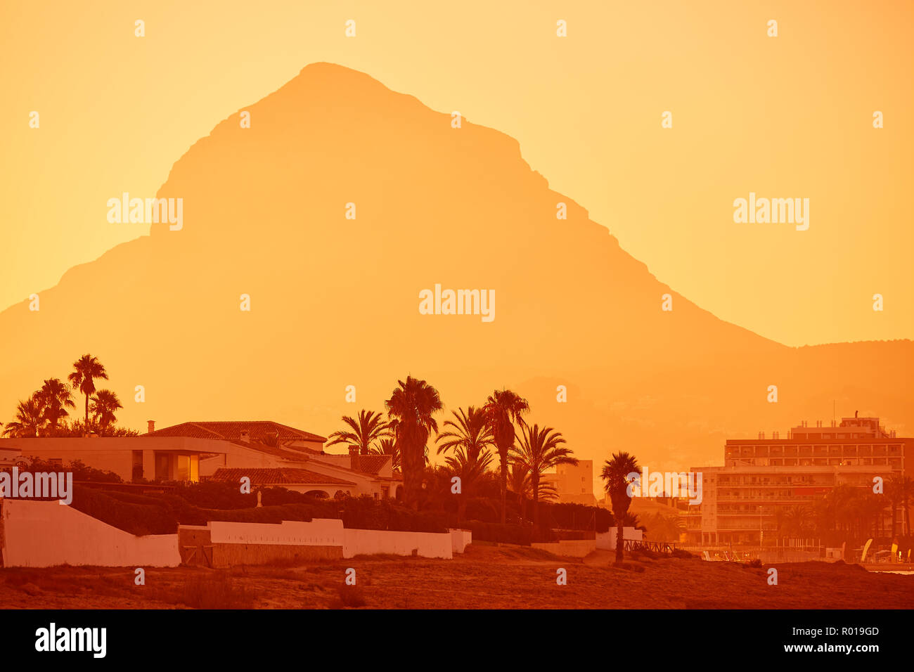 Javea also Xabia sunset beach and Montgo mountain at Alicante of Spain Stock Photo