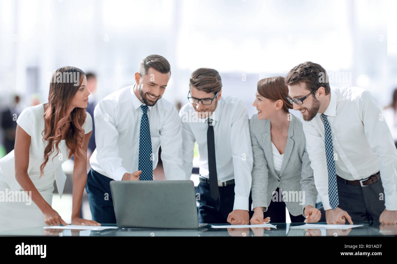 business team standing near the desktop Stock Photo - Alamy