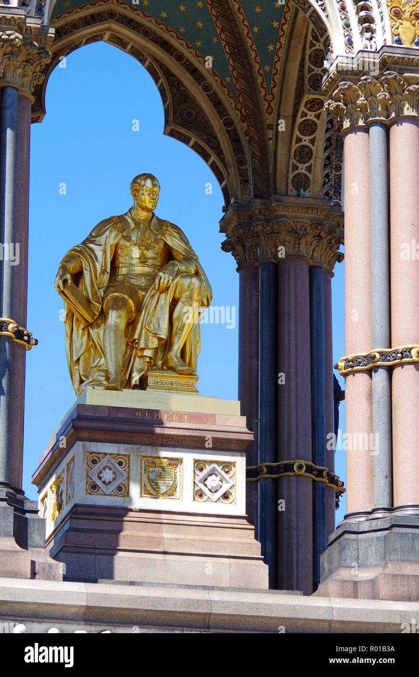 Gilded bronze seated statue of Prince Albert of Saxe-Coburg beneath an elaborate canopy in the centre of the Albert memorial Kensington Gardens London Stock Photo