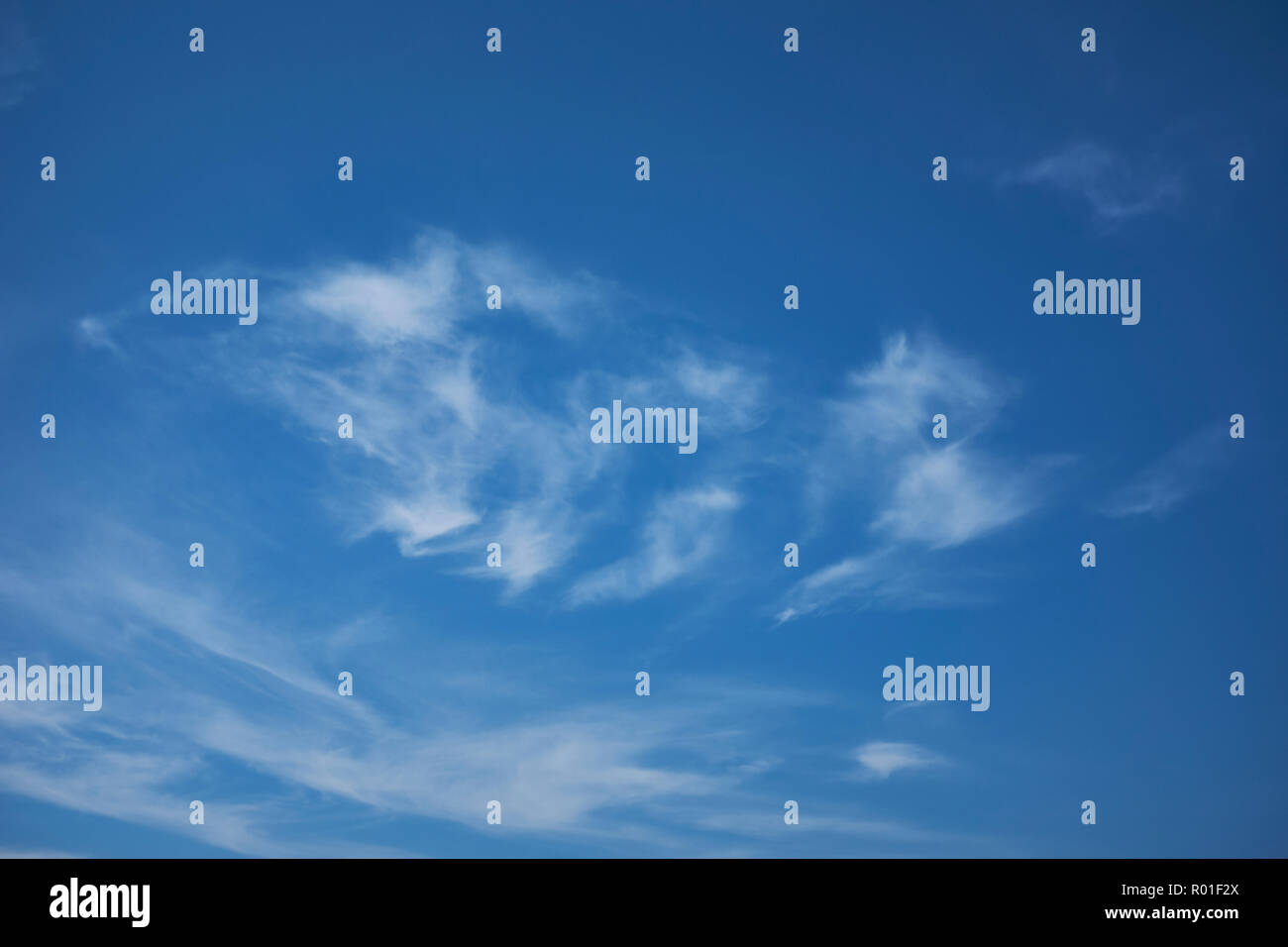 Blue sky with a small amount of thin white clouds Stock Photo
