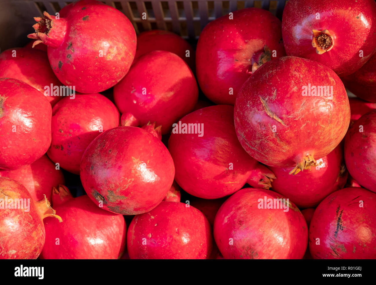 Basket of Pomegranates in the Lofou Taverna, Lofou, Cyprus Stock Photo