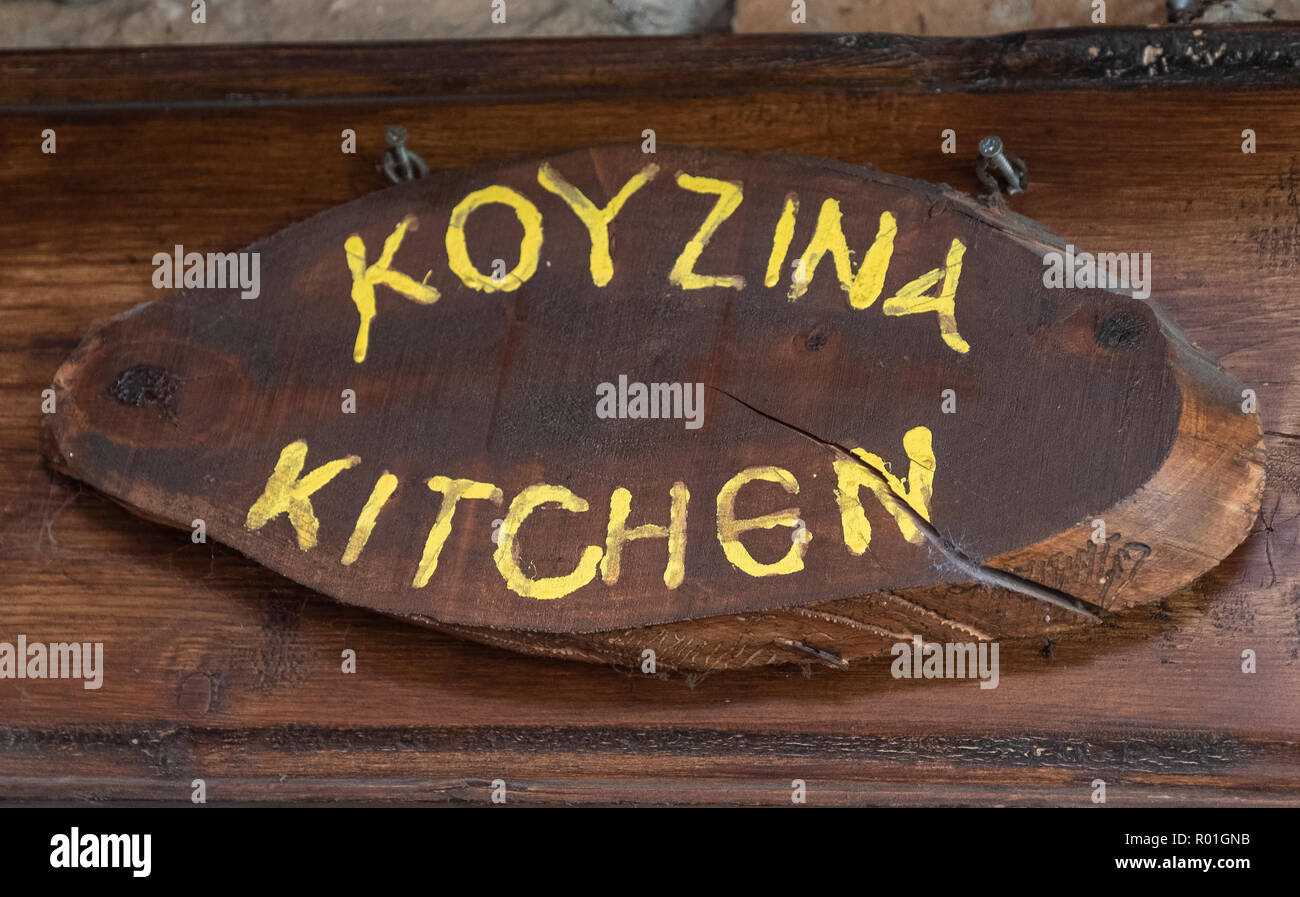 Wooden kitchen sign in the Lofou taverna, Lofou village cyprus Stock Photo