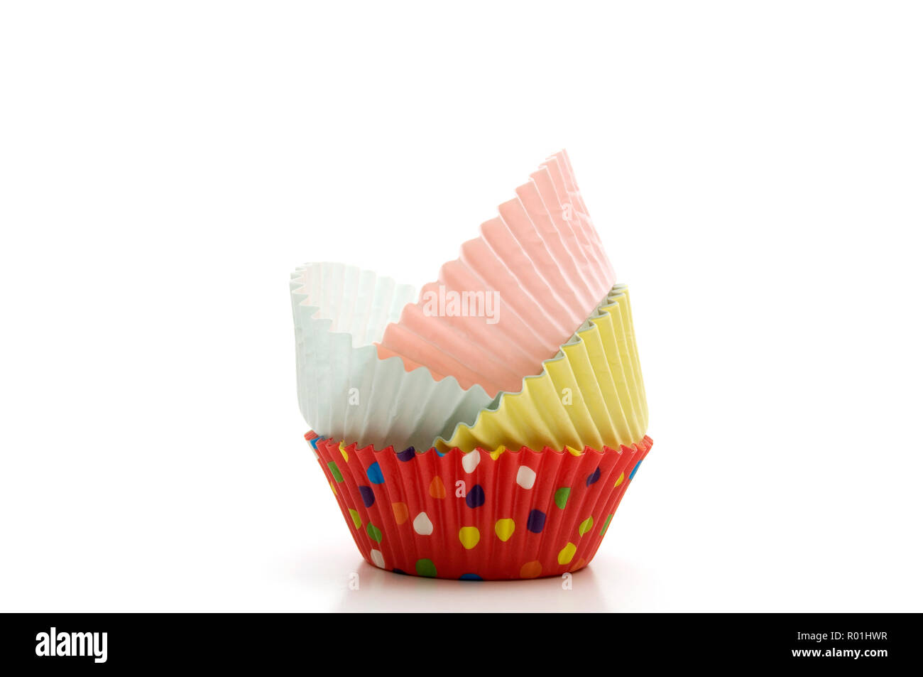 Stacked Multi-Colored Muffin Baking Cups on White Background Horizontal Image Stock Photo