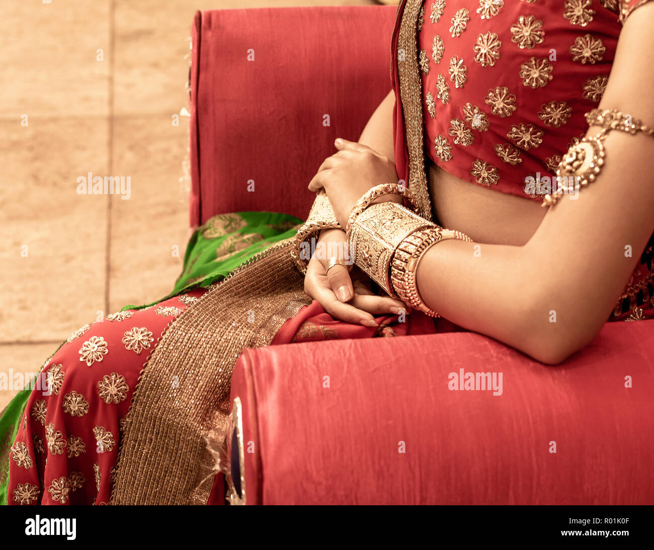 Close up  of Decorative Golden Bangles of Indian Bride with Selective Focus. Stock Photo