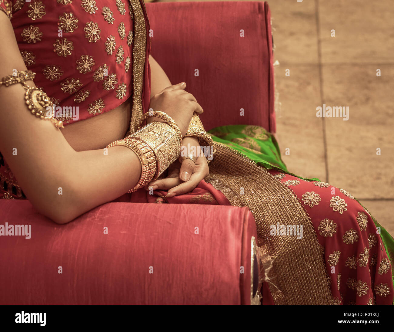 Close up  of Decorative Golden Bangles of Indian Bride with Selective Focus. Stock Photo