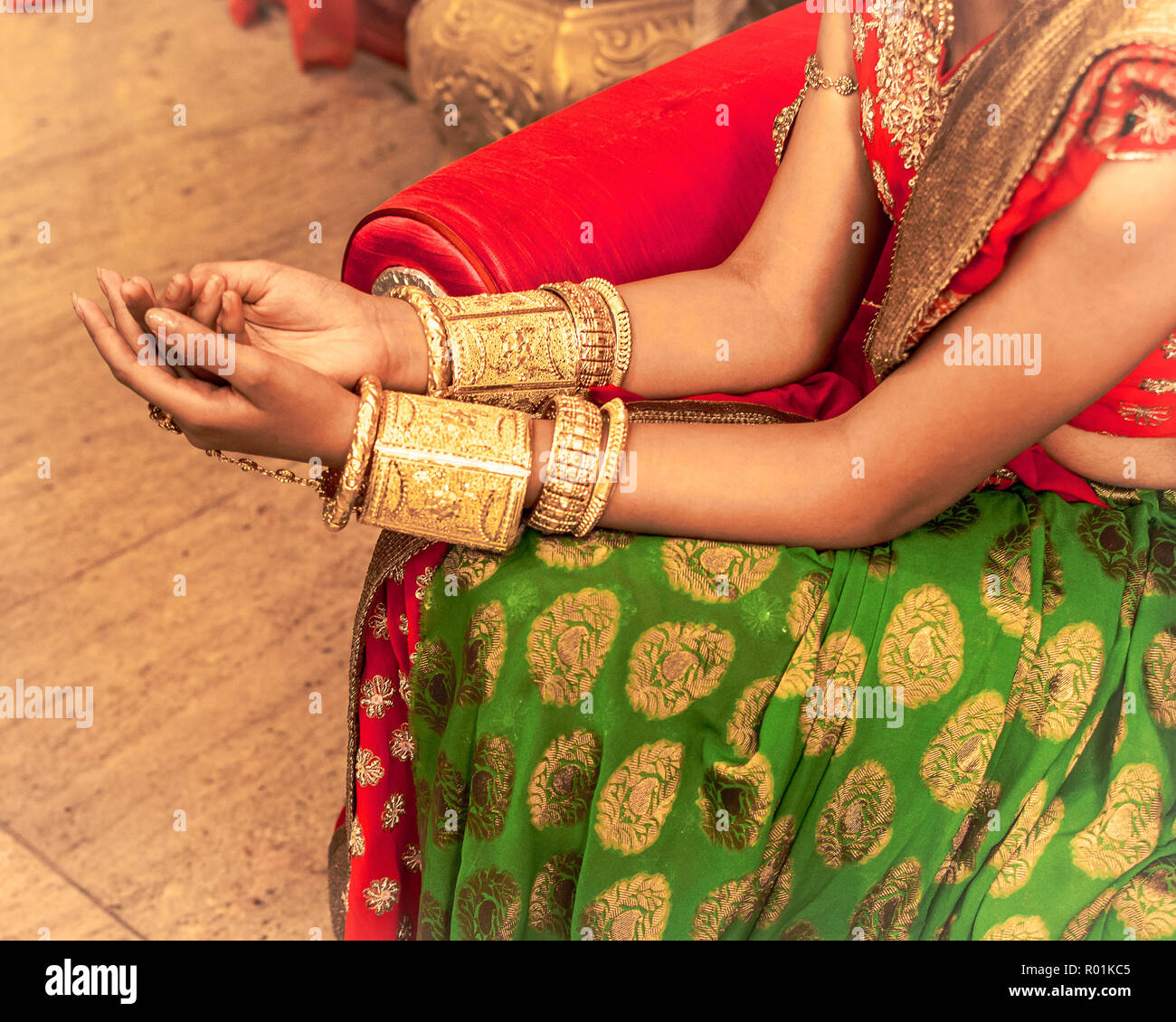 Close up  of Decorative Golden Bangles of Indian Bride with Selective Focus. Stock Photo