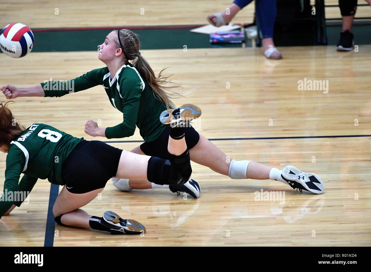 Player making a diving dig for an opponent's shot. USA. Stock Photo