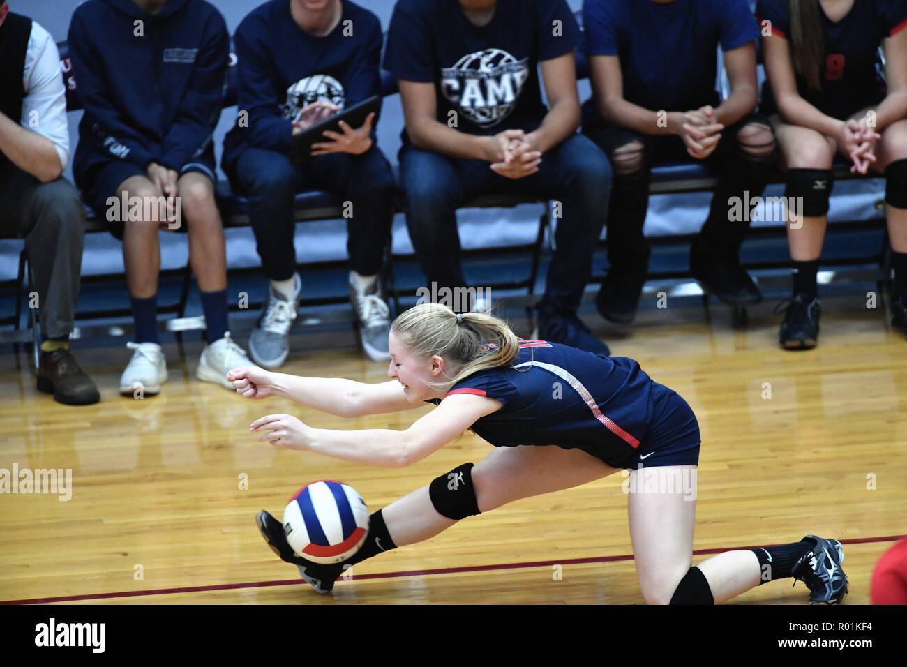 Player with an unsuccessful effort to dig an opposing kill shot. USA. Stock Photo