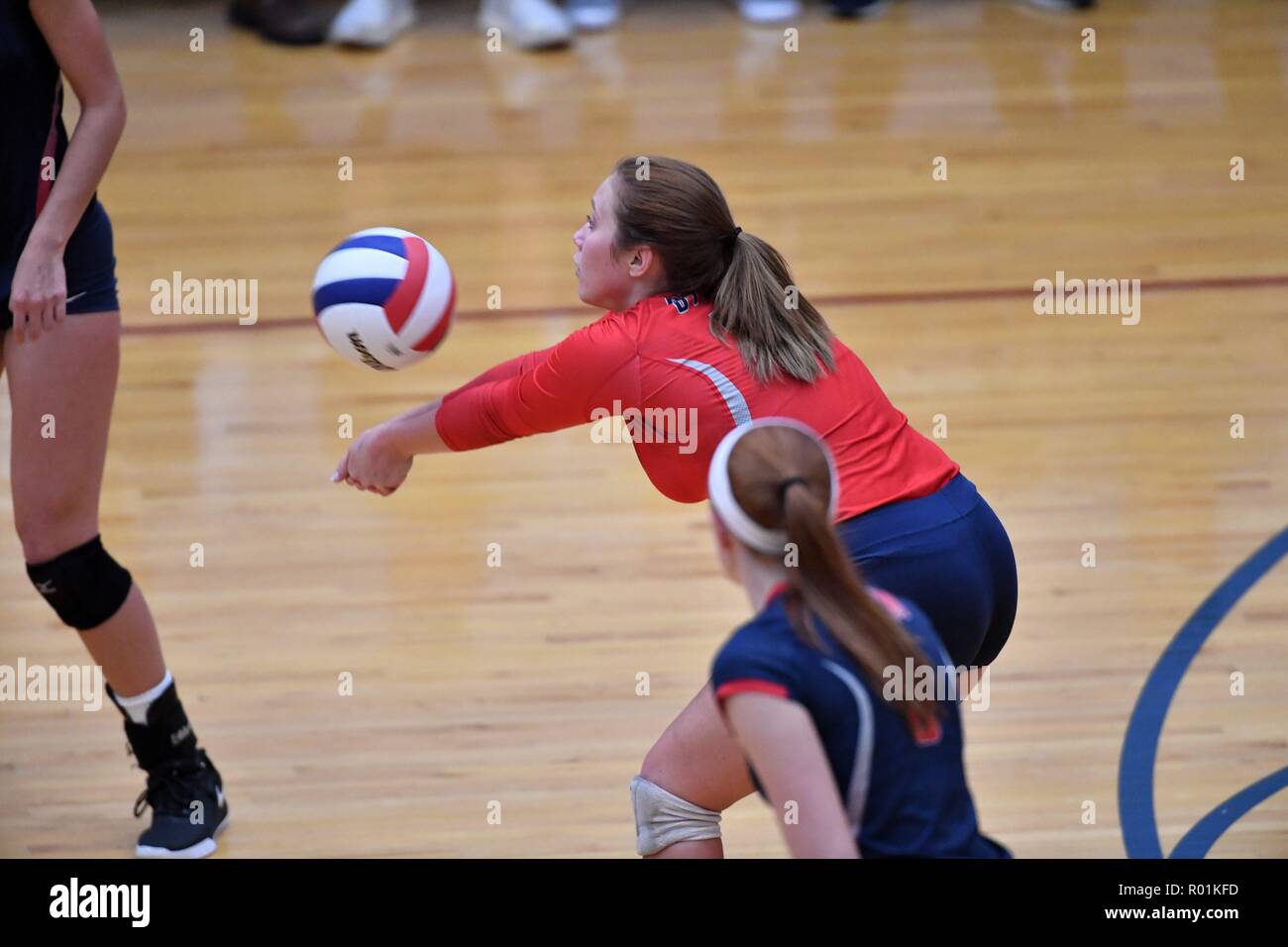 Player accepting and returning an opposing serve at mid-court. USA Stock Photo