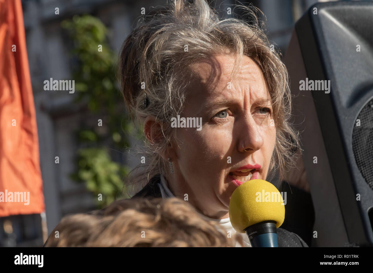 London, UK. 31st October 2018. Dr Gail Bradbrook speaks at the Extinction Rebellion protest in Parliament Square. Other speeches were from climate activists including  Swedish schoolgirl Greta Thunberg, campaigner Donnachadh McCarthy, Labour MP Clive Lewis and economist and Green MEP Molly Scott Cato before making a 'Declaration of Rebellion' against the British Government for its criminal inaction in the face of climate change catastrophe and ecological collapse. Credit: Peter Marshall/Alamy Live News Stock Photo