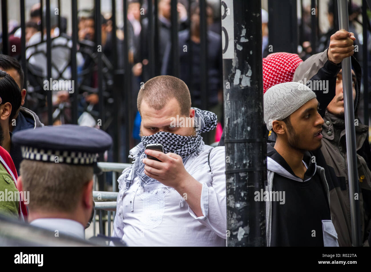 London, UK. 30th May, 2014. File Image from 30-05-2014: Lewis Ludlow, 26, from Rochester in Kent, a Muslim convert (pic centre, with phone) also used the name Ali Hussain, is due to be sentenced for plotting an Islamic State-inspired attack on Oxford Street in which he hoped to kill 100 people. Ludlow is seen here in 2014 outside the London Central Mosque during a protest organised by radical cleric Anjem Choudary and his banned Al-Muhajiroun (ALM) group. Credit: Guy Corbishley/Alamy Live News Stock Photo