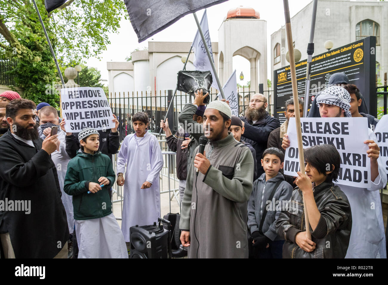 London, UK. 30th May, 2014. File Image from 30-05-2014: Lewis Ludlow, 26, from Rochester in Kent, a Muslim convert (seen second left, face covering) also used the name Ali Hussain, is due to be sentenced for plotting an Islamic State-inspired attack on Oxford Street in which he hoped to kill 100 people. Ludlow is seen here in 2014 outside the London Central Mosque during a Islamist protest with speaker Mohammed Mizanur Rahman (with mic) who was jailed in 2016 along with radical cleric Anjem Choudary. Credit: Guy Corbishley/Alamy Live News Stock Photo