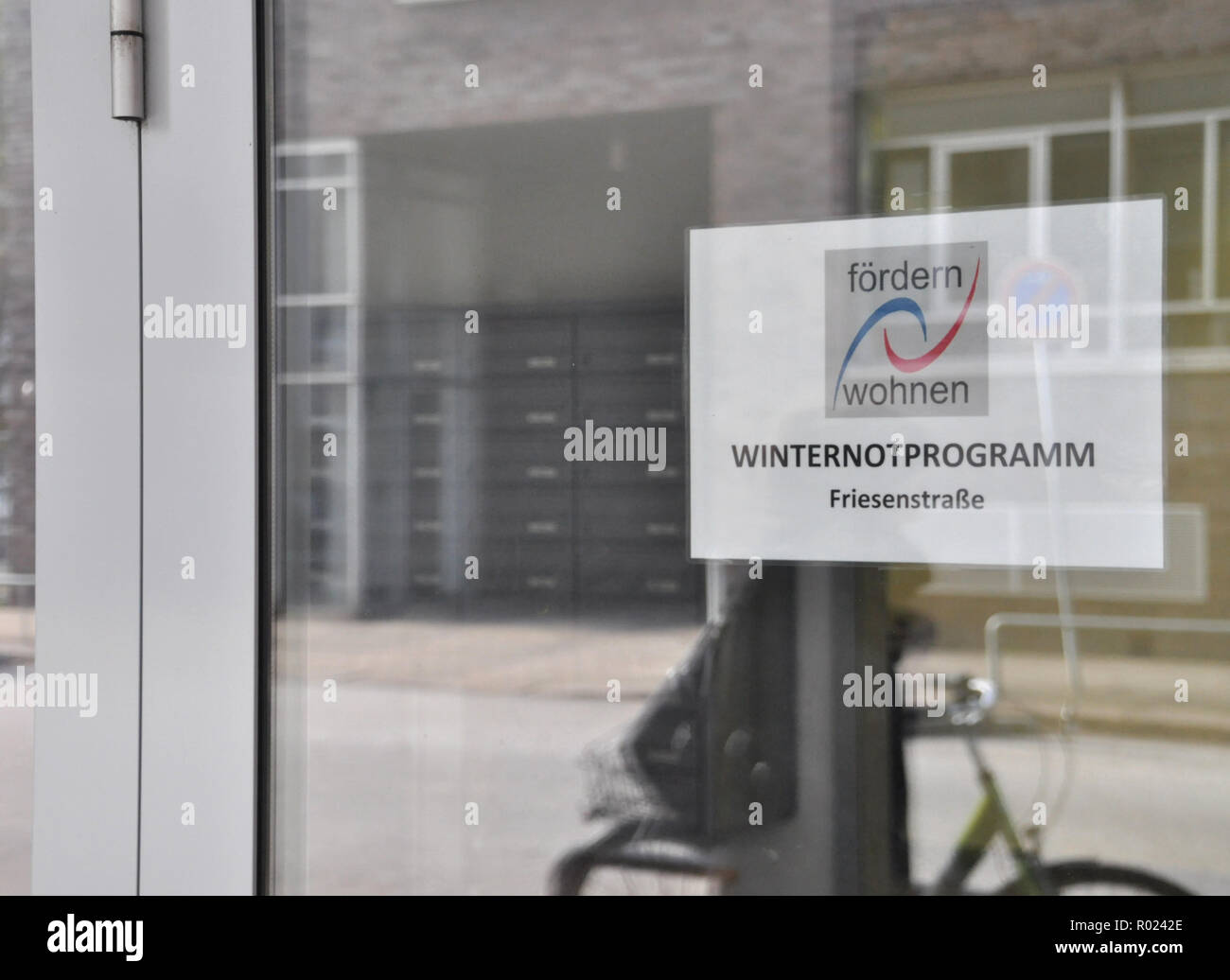 Hamburg, Germany. 01st Nov, 2018. A sign with the inscription 'Winternotprogramm' hangs at the entrance of the emergency accommodation in the Friesenstraße. On Thursday the winter emergency programme for homeless people starts in Hamburg. Credit: Hannah Wagner/dpa/Alamy Live News Stock Photo