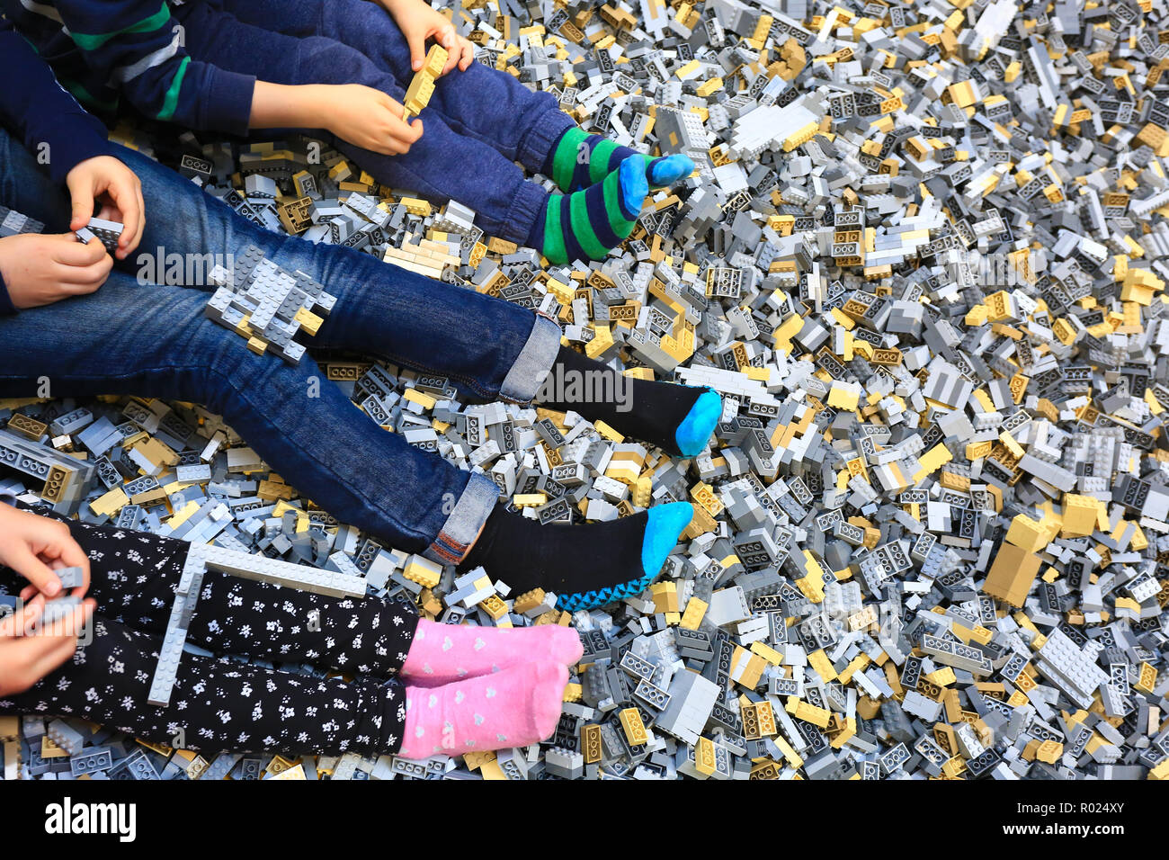 Children playing with lego bricks Stock Photo