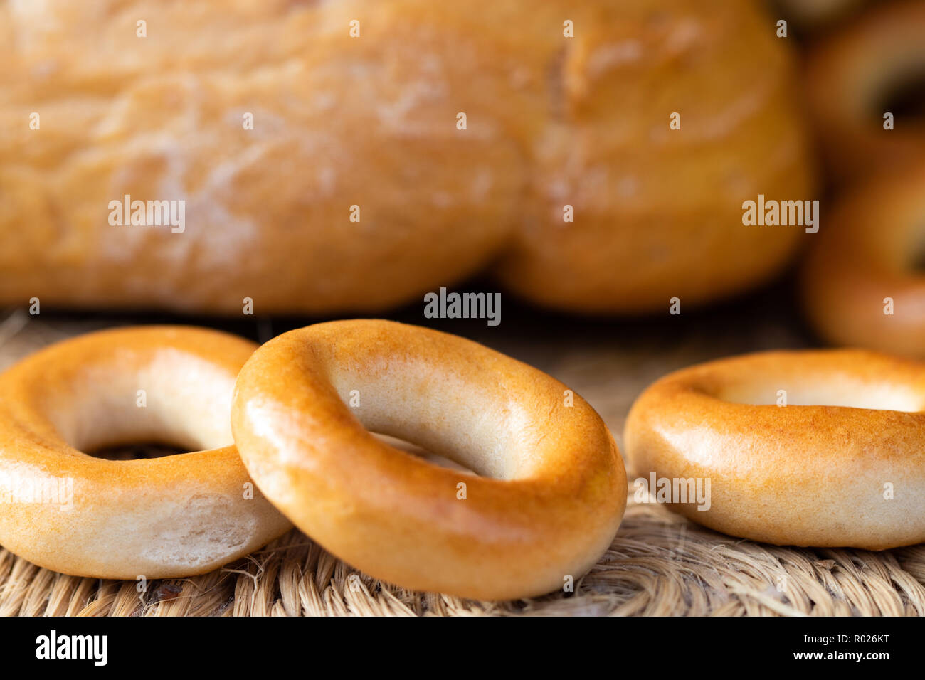 Loaf of white wheat bread, bagels and buns. Close up. Home bakery