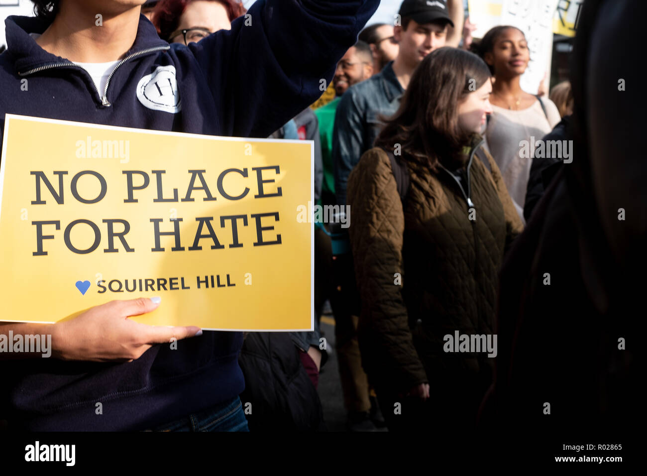 A placard reads 'No place for hate' during the march. Thousands of people took part in a march in Pittsburgh to pay respect to the victims who lost their lives in the Trees of Life Shooting. Stock Photo