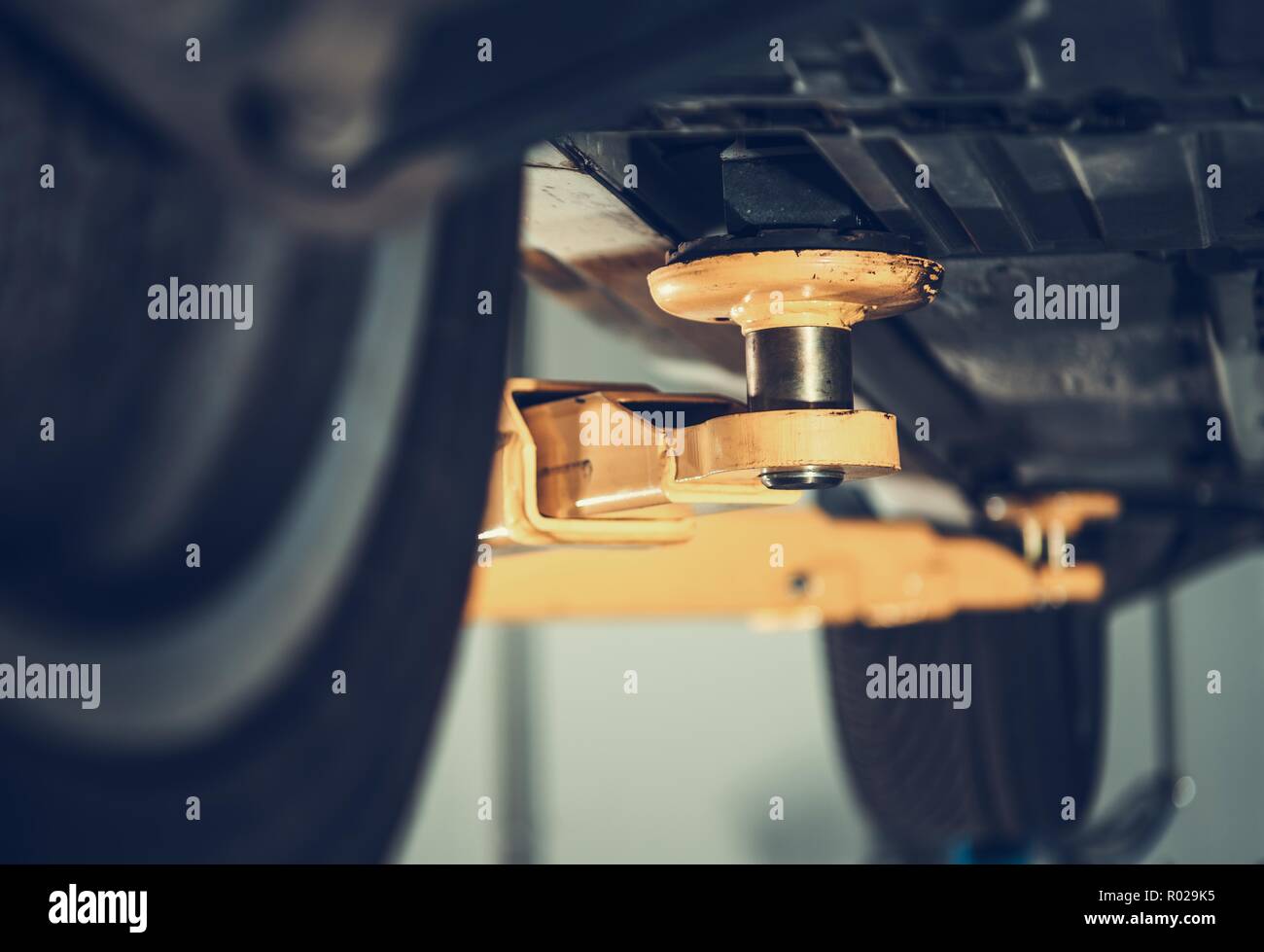 Car Servicing on a Lift. Automotive Maintenance Concept Stock Photo Alamy