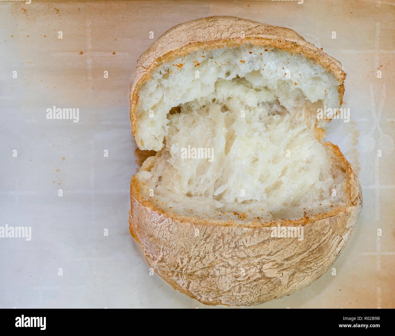 Fresh catted bread bun on the parchment paper Stock Photo Alamy