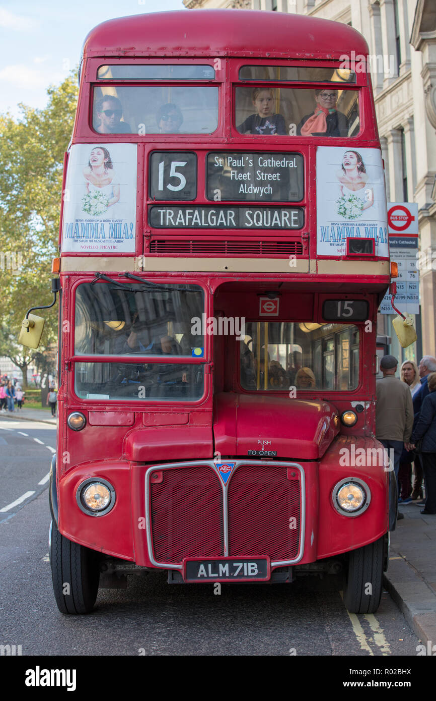 Bus route 15 in London, UK, driven by a traditional, iconic and heritage red bus between Trafalgar Square and the Tower of London, mainly for tourists Stock Photo