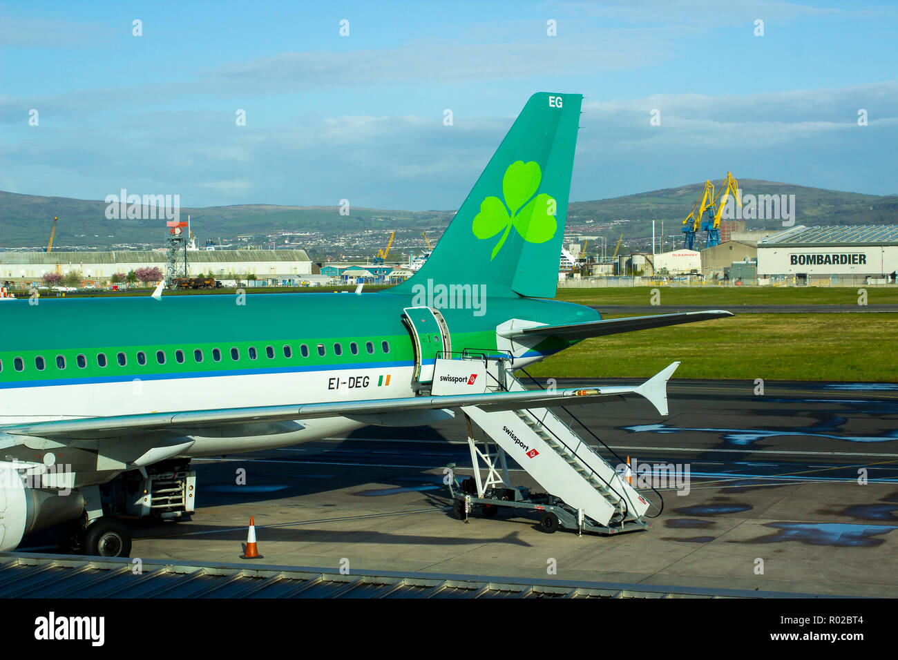 2 May 2018 An Aer Lingus jet with livery sits on the apron at Belfast City Airport in preparation for passenger boarding. Stock Photo