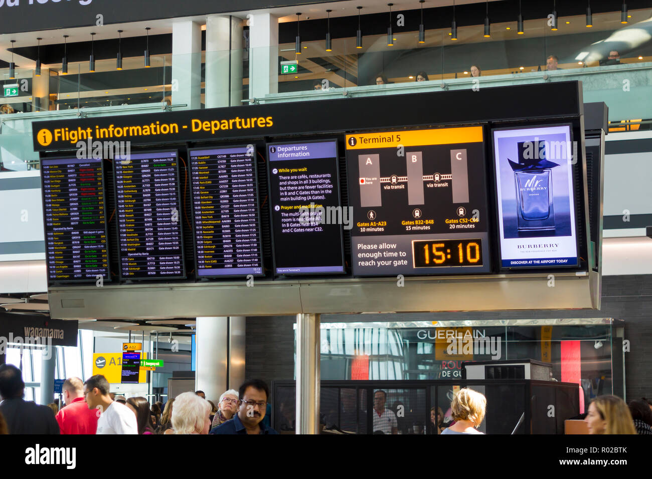 2 May 2018 A large flight information digital display board at Terminal 5 departures in Heathrow Airport England, This busy airport is one of the larg Stock Photo