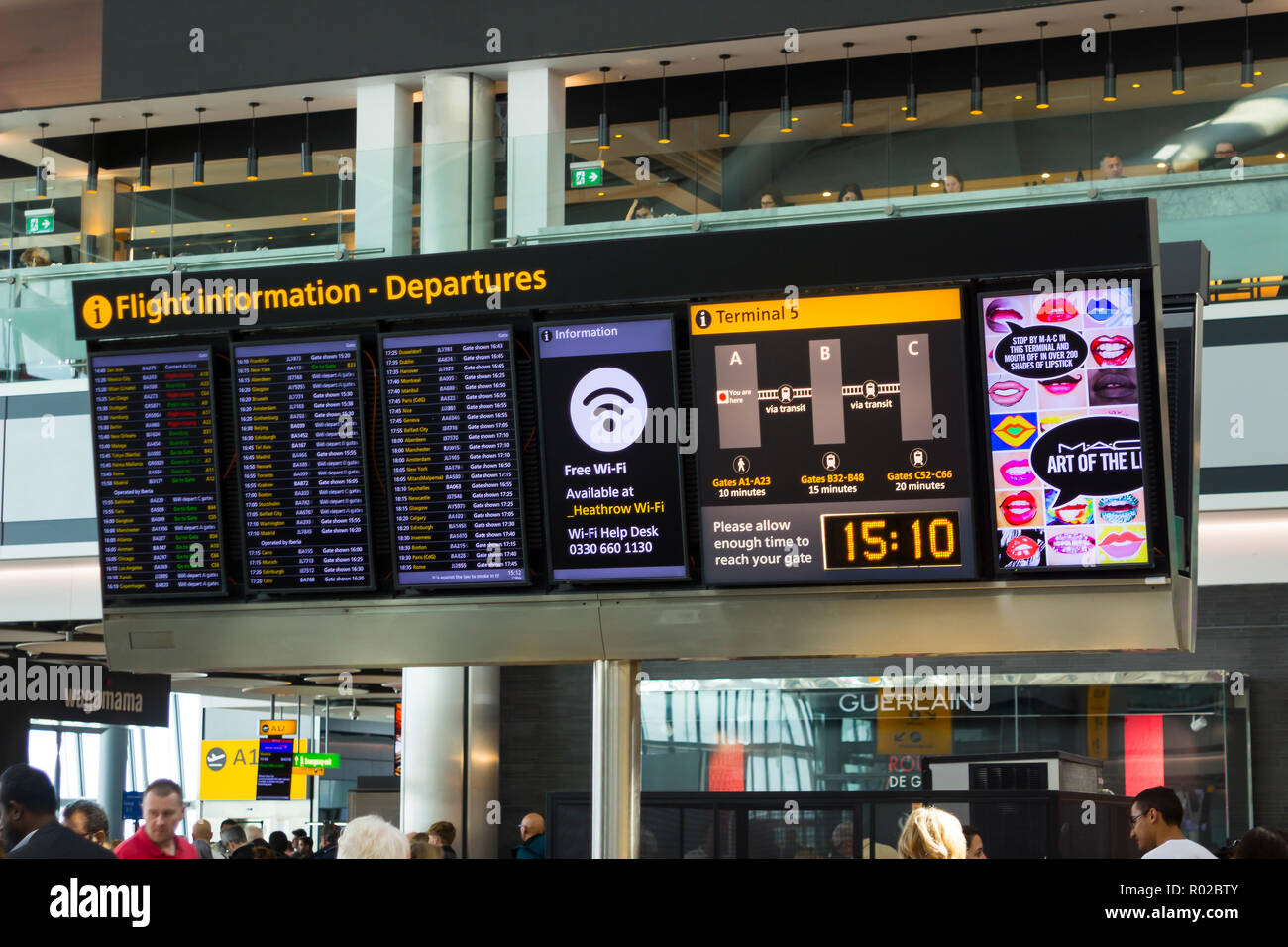 2 May 2018 A large flight information digital display board at Terminal 5 departures in Heathrow Airport England, This busy airport is one of the larg Stock Photo