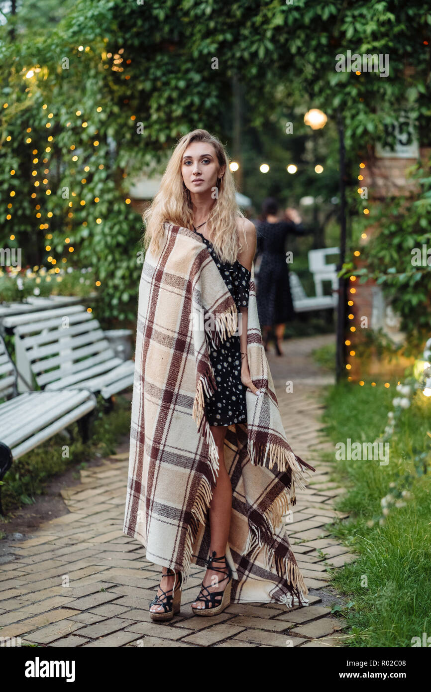 Beautiful girl posing in the park at the camera Stock Photo - Alamy
