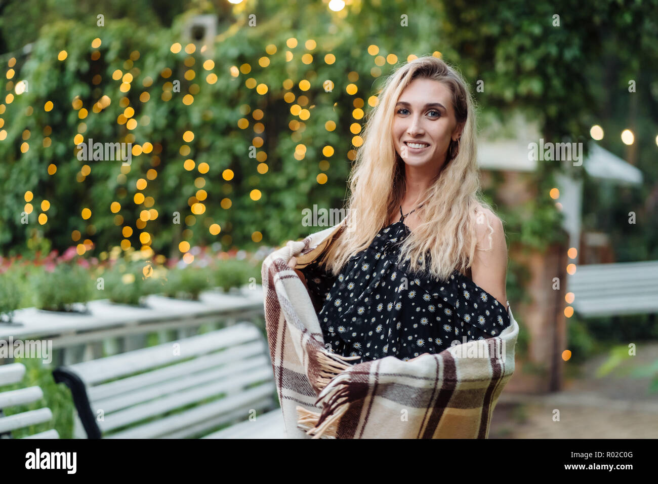 Beautiful girl posing in the park at the camera Stock Photo - Alamy
