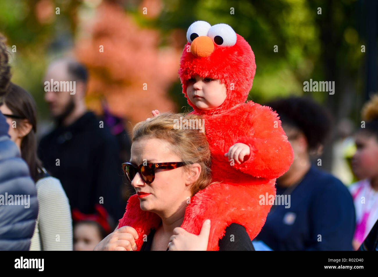 A child seen dressed as Elmo during the parade. Hundreds of parents and