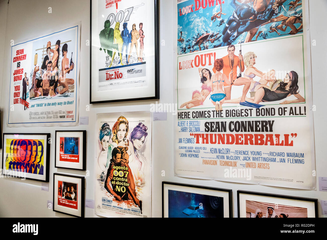 London England,UK,Mayfair,New Bond Street,Sotheby's fine art auction house,interior inside,gallery,exhibition,vintage movie poster,James Bond,007,doub Stock Photo