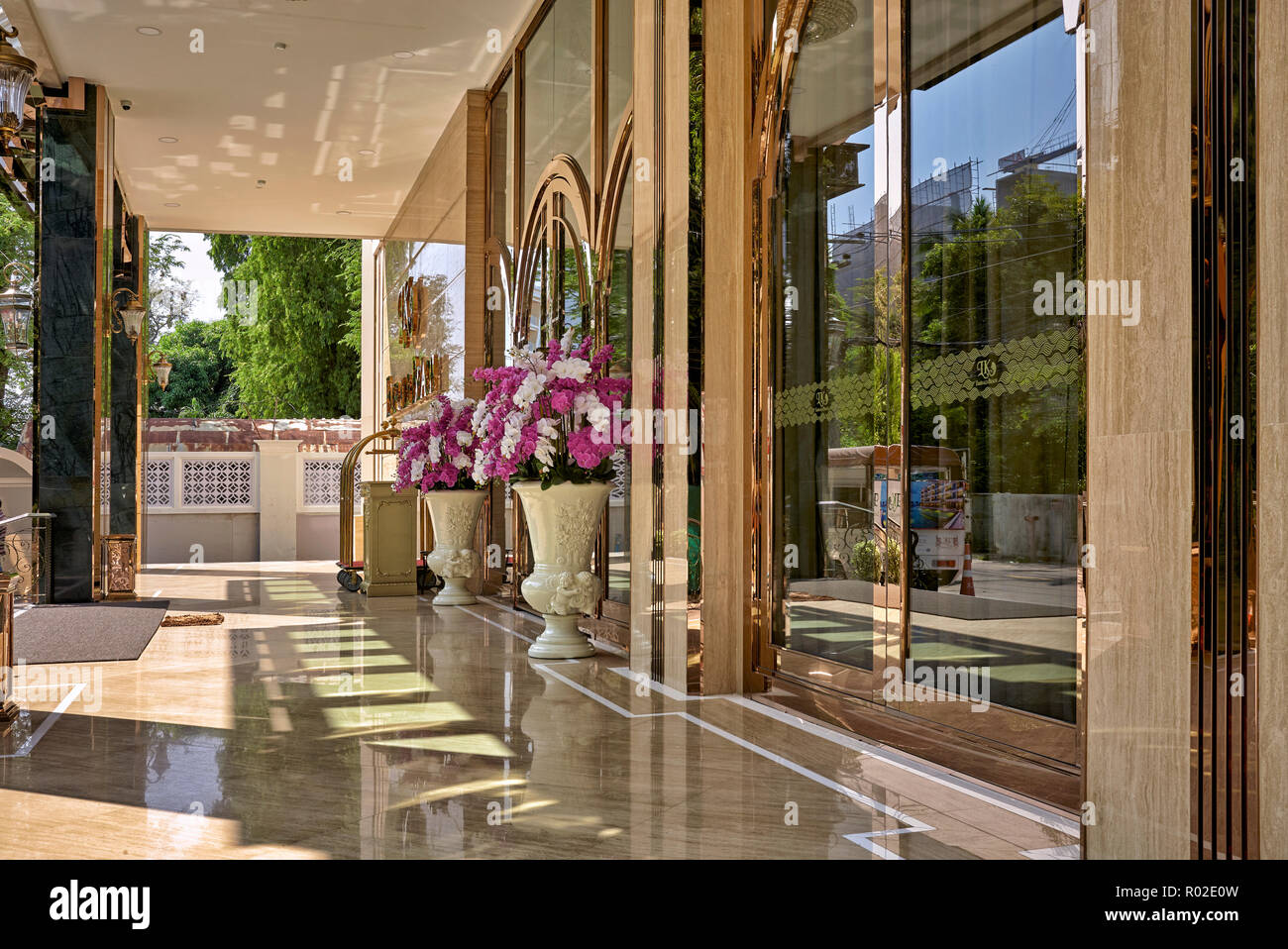 Hotel entrance. Polished copper glass front. Thailand hotels, Southeast