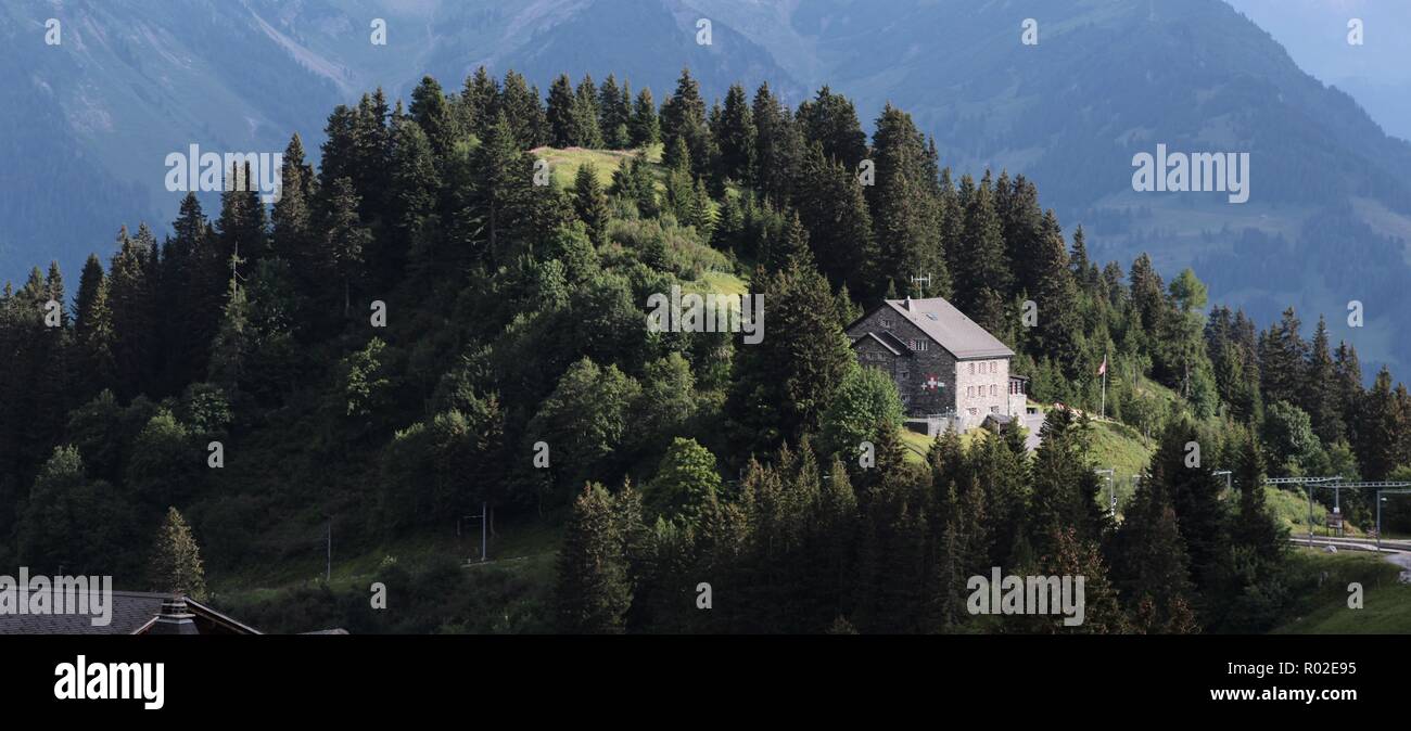 alpine scenery with hill and house Stock Photo