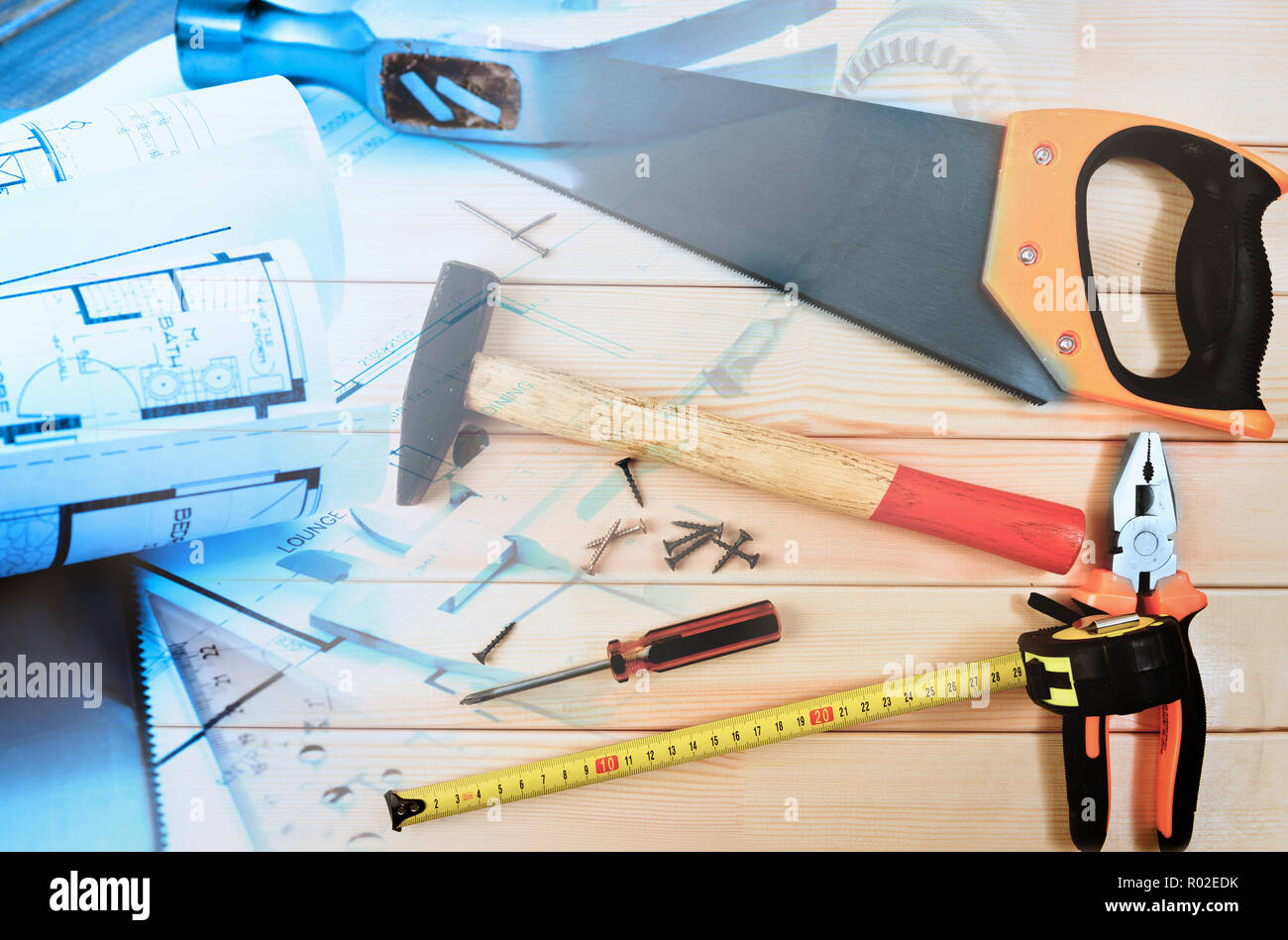 Assorted work tools and home design blueprints collage Stock Photo