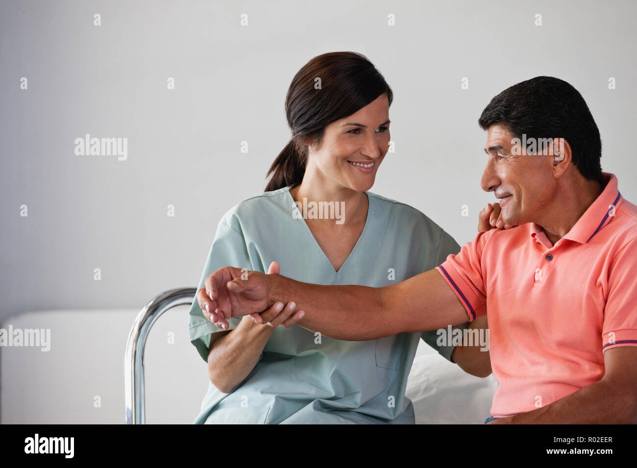 Man receiving physical therapy from his nurse Stock Photo Alamy