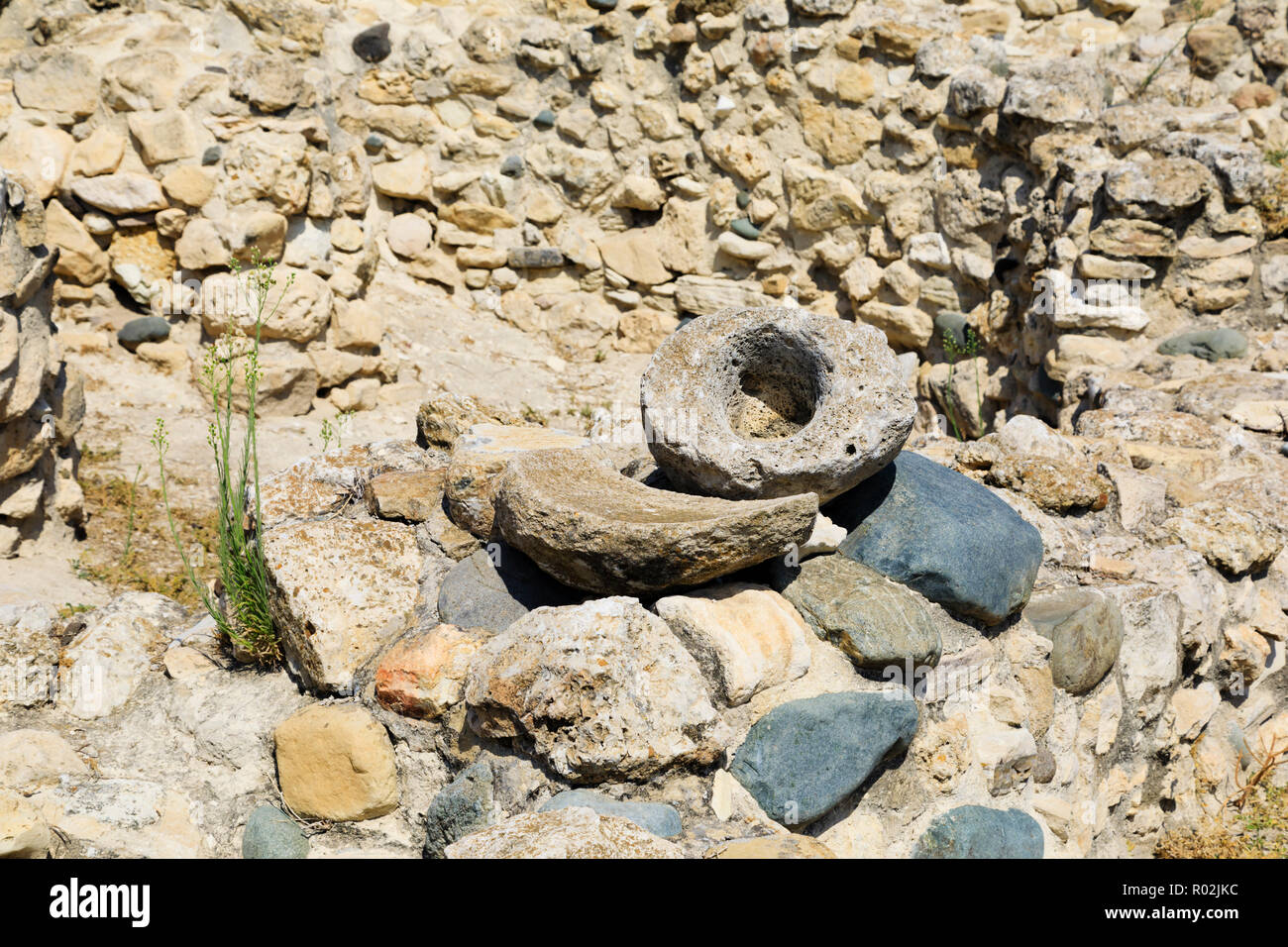 Pestle and mortar with grindstone utensils at UNESCO World Heritage