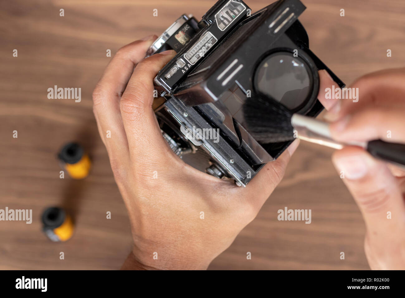 Performing cleaning of vintage photo camera Stock Photo Alamy