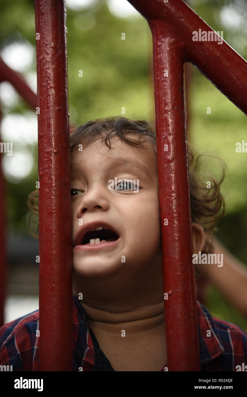 cute smiling kids enjoying play time with playful mood in amusement park or children park in New Delhi, India, Asia Stock Photo