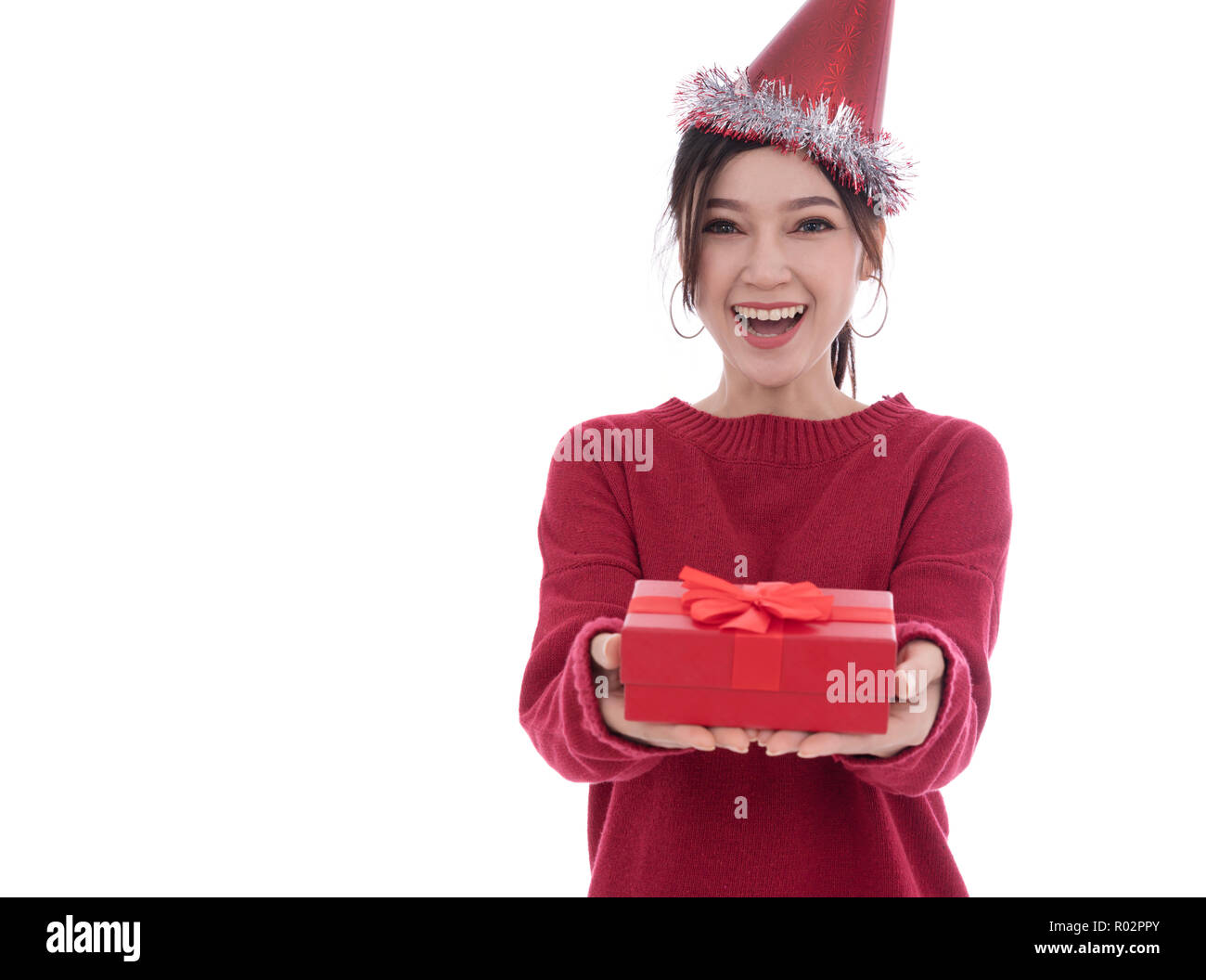happy young woman with hat and holding a christmas gift box isolated on ...
