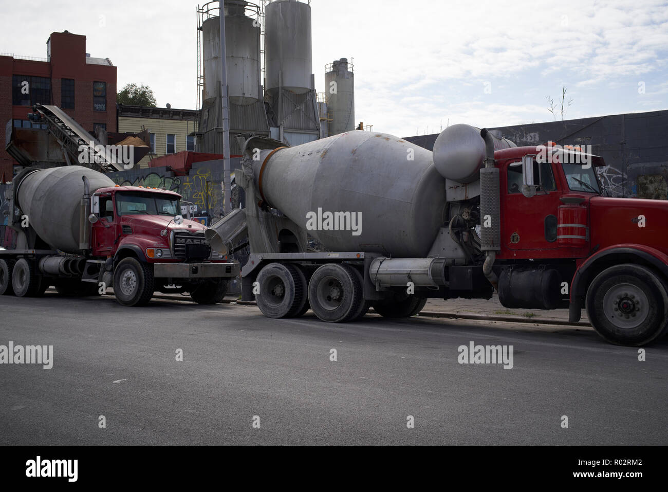 concrete delivery trucks waiting to be loaded Stock Photo