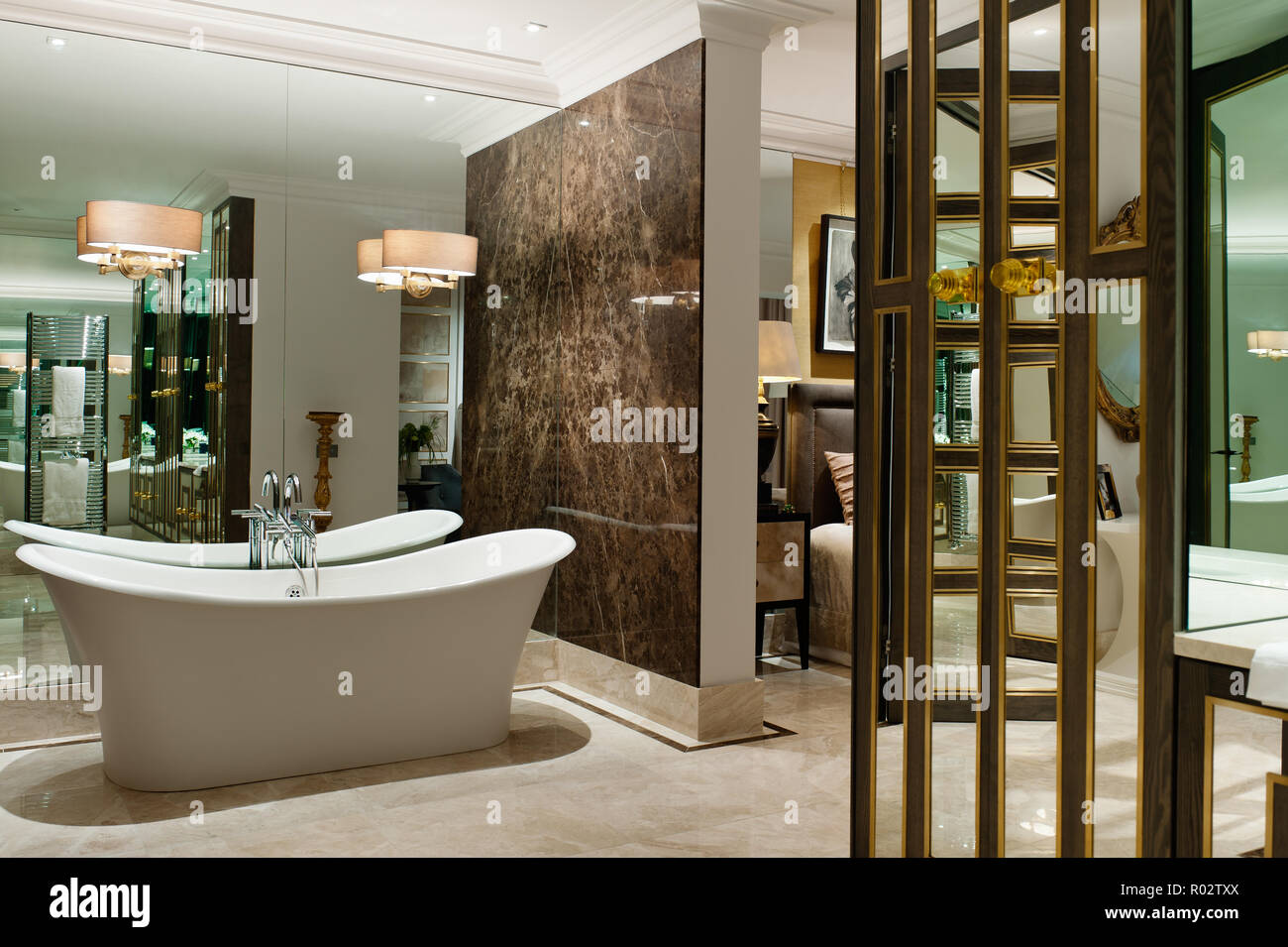 Luxury ensuite bathroom with mirrored wall Stock Photo