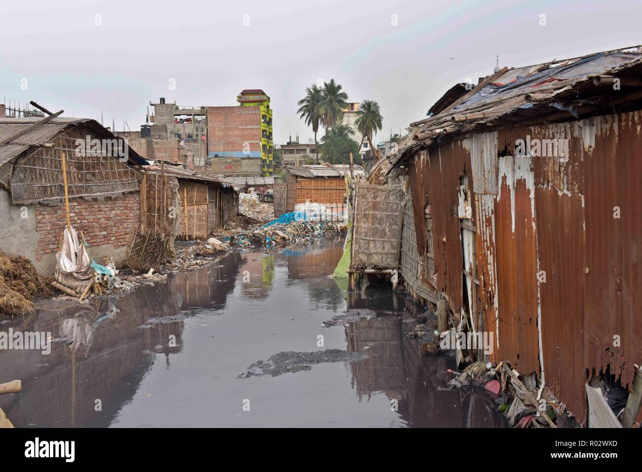Dhaka, Bangladesh - March 06, 2017: A canal polluted by waste and untreated chemical discharges from tanneries at Hazaribagh in Dhaka. Stock Photo