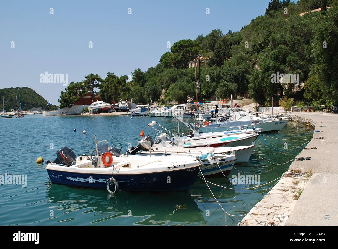 Boata moored in the harbour at Lakka on the Greek island of Paxos on June 10, 2014. The 13km long island has a population of around 2300. Stock Photo